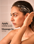 Model massaging Hydrating Conditioner into her hair. 