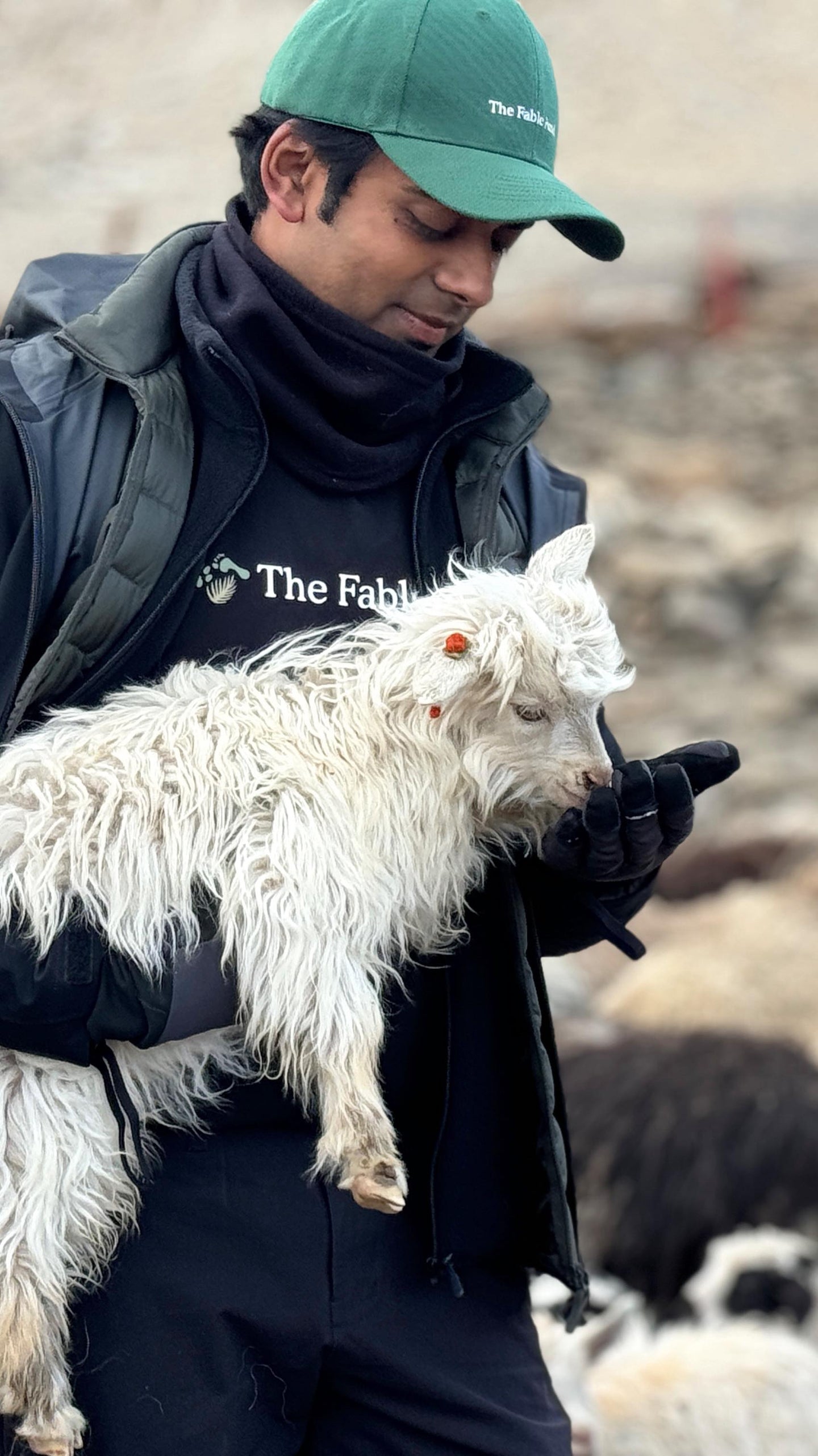 Image of Fable and Mane Founder Akash holding a mountain goat